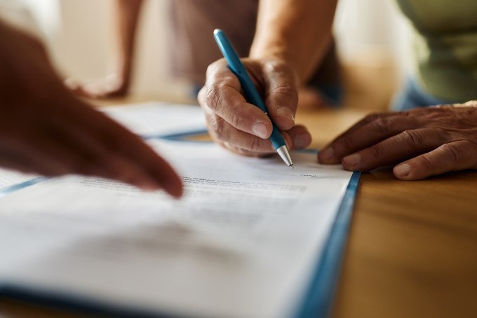 A document being signed on a table